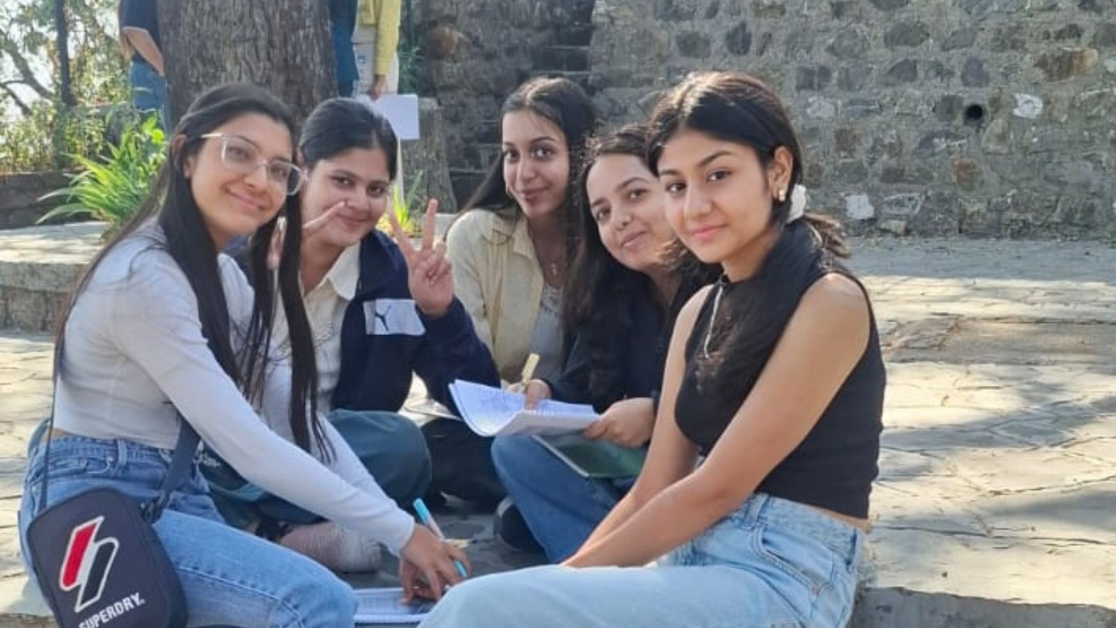 Young people meditating outdoors in Landour